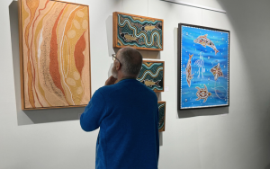 Byron community member looking at NAIDOC gallery art at Byron CoLab